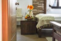 Posteľ alebo postele v izbe v ubytovaní Etno Garden Exclusive Rooms
