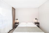 Postel nebo postele na pokoji v ubytování Bella Apartments & Rooms