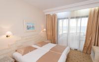 L'Orient Palace Resort and Spaにあるベッド