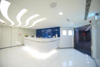 a lobby with a white floor and a white ceiling at Ximen Airline Hotel in Taipei