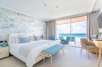 Postel nebo postele na pokoji v ubytování Hotel Lava Beach