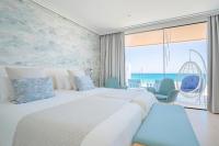 Postel nebo postele na pokoji v ubytování Hotel Lava Beach