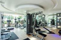 a gym with several tread machines in a room at Katathani Phuket Beach Resort - SHA Extra Plus in Kata Beach