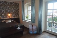 Postel nebo postele na pokoji v ubytování Hotel Peregrin