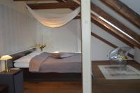Postel nebo postele na pokoji v ubytování Hotel Peregrin