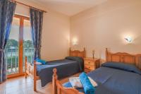 Postel nebo postele na pokoji v ubytování Villa Puerto Alcudia - Lago Aran Berna