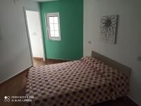 Posteľ alebo postele v izbe v ubytovaní casa rural Sombra de la Atalaya