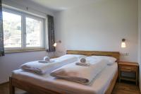 Posteľ alebo postele v izbe v ubytovaní Tauern Relax Lodges by we rent, SUMMERCARD INCLUDED