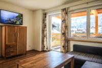 Televízia a/alebo spoločenská miestnosť v ubytovaní Tauern Relax Lodges by we rent, SUMMERCARD INCLUDED