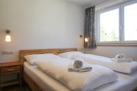 Posteľ alebo postele v izbe v ubytovaní Tauern Relax Lodges by we rent, SUMMERCARD INCLUDED