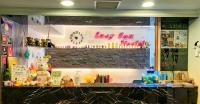 a shop counter with a sign that says boy bear world at EasyInn Hotel &amp; Hostel in Tainan