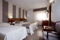 Postel nebo postele na pokoji v ubytování Hotel Marivella