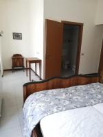 Posteľ alebo postele v izbe v ubytovaní Residenza Santa Valeria