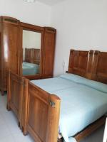 Posteľ alebo postele v izbe v ubytovaní Residenza Santa Valeria