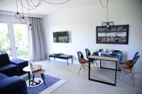 Televízia a/alebo spoločenská miestnosť v ubytovaní Słoneczne Tarasy II - Apartments