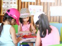a group of young girls sitting at a table at Novotel Lombok Resort & Villas in Kuta Lombok