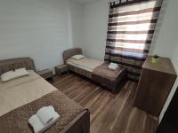 Łóżko lub łóżka w pokoju w obiekcie Hatvan Corner Apartments 2