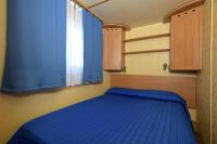 Posteľ alebo postele v izbe v ubytovaní Camping Village Tuscia Tirrenica