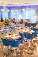 a group of tables and chairs in a room at The Park New Delhi in New Delhi