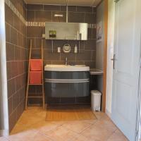 a bathroom with a sink and a mirror at La Picholine in Sorède