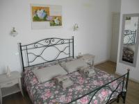 A bed or beds in a room at B&B Mimosa e Lillà