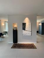 A television and/or entertainment centre at HT Hotel Trieste