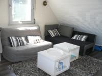 a living room with a couch and a coffee table at Sauvagere, studio à Carnac in Carnac