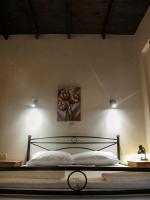 Postel nebo postele na pokoji v ubytování Apanemia Rooms