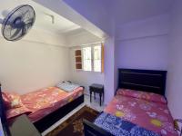 Postel nebo postele na pokoji v ubytování Seaside Two-Bedroom Chalet Sidi Krir