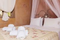 Postel nebo postele na pokoji v ubytování Mounty Island Villas-Nefeli