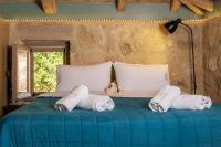 Postel nebo postele na pokoji v ubytování Mounty Island Villas-Nefeli