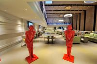 two red man statues on display in a restaurant at Green World Hotel - Zhonghua in Taipei