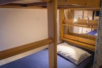 two bunk beds in a hostel room at Fish Hostel in Yingge