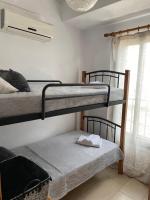 Postel nebo postele na pokoji v ubytování Seashell Apartments