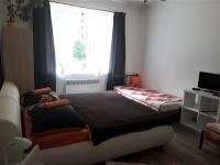 Postel nebo postele na pokoji v ubytování Apartmány Karlštejn