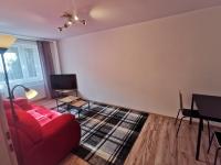 Televízia a/alebo spoločenská miestnosť v ubytovaní Apartament KAKADU