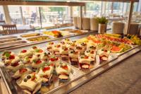 a buffet line with many different types of food at Hotel Astoria in Jáchymov