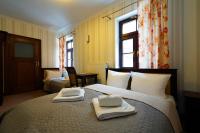 Postel nebo postele na pokoji v ubytování Hotelik & Restauracja Złota Kaczka