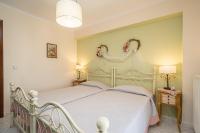 Posteľ alebo postele v izbe v ubytovaní AIGLI ELEGANT SEA VIEW APARTMENT IN ARGOSTOLI