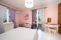Posteľ alebo postele v izbe v ubytovaní AIGLI ELEGANT SEA VIEW APARTMENT IN ARGOSTOLI