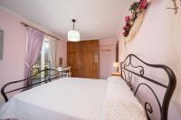 Posteľ alebo postele v izbe v ubytovaní AIGLI ELEGANT SEA VIEW APARTMENT IN ARGOSTOLI