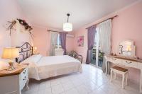 Posteľ alebo postele v izbe v ubytovaní AIGLI ELEGANT SEA VIEW APARTMENT IN ARGOSTOLI
