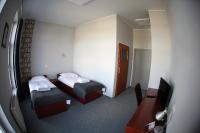 Łóżko lub łóżka w pokoju w obiekcie Hotel Centrum