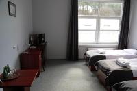Łóżko lub łóżka w pokoju w obiekcie Hotel Centrum