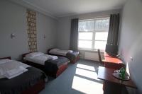 Łóżko lub łóżka w pokoju w obiekcie Hotel Centrum