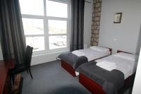 Łóżko lub łóżka w pokoju w obiekcie Hotel Centrum