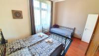 Posteľ alebo postele v izbe v ubytovaní Deák Apartman