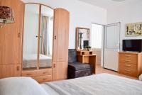 A television and/or entertainment centre at Family Hotel Apolonia