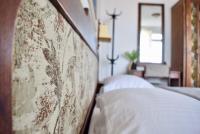 A bed or beds in a room at Family Hotel Apolonia