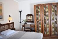 A bed or beds in a room at Family Hotel Apolonia